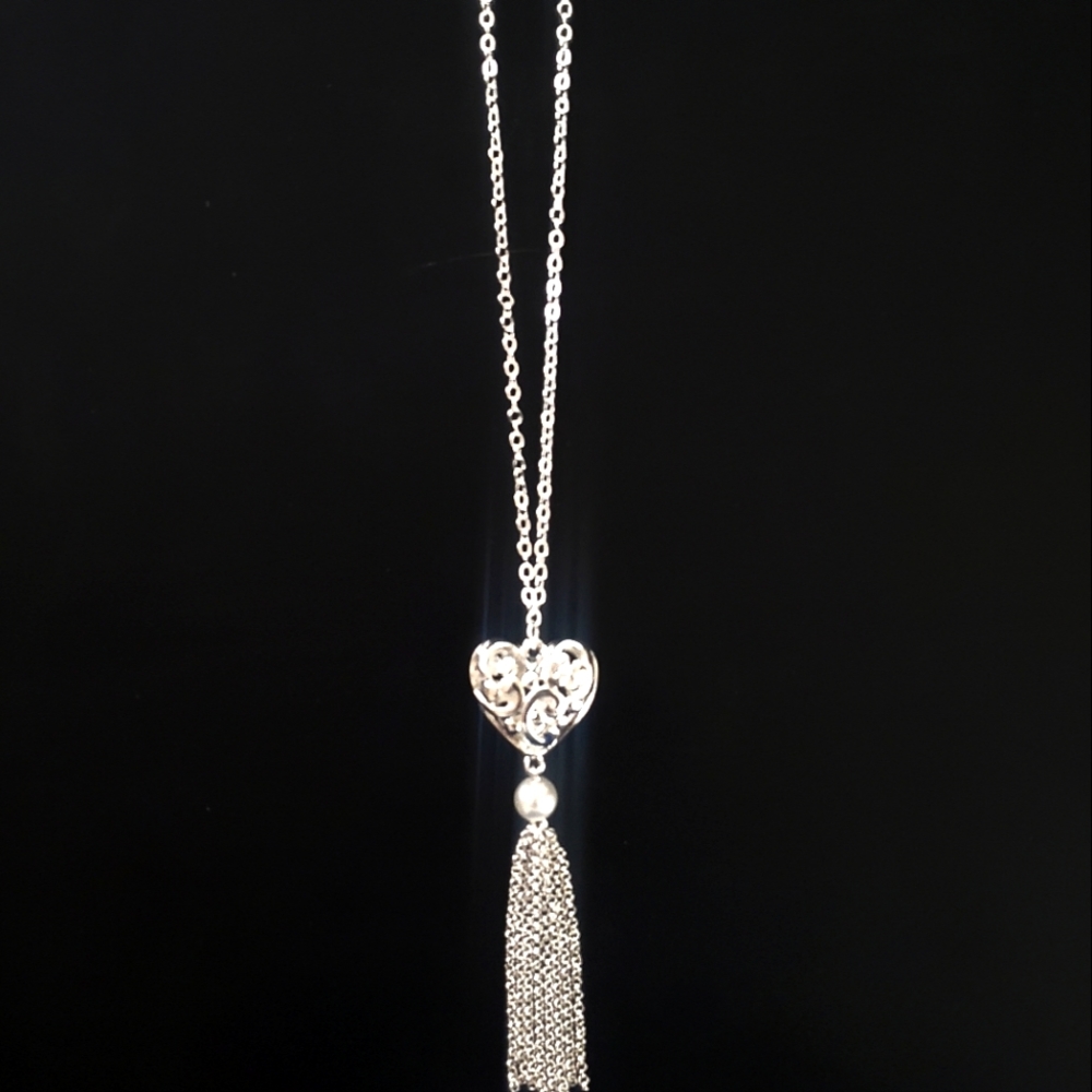 Kim rogers with a heart pendant and tassel